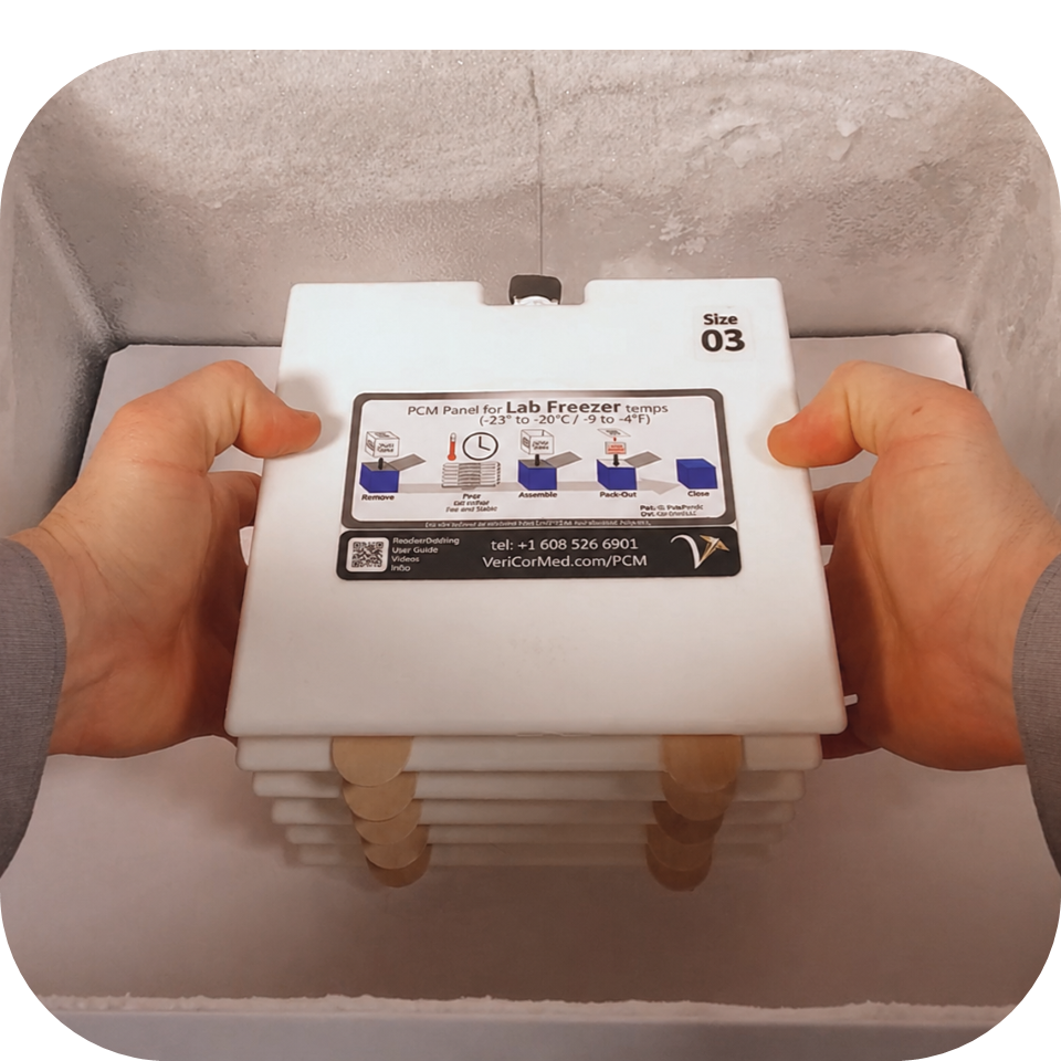Man setting Phase Change Material (PCM) cooler panels into freezer to prepare for cool cube medical cooler temperature stability