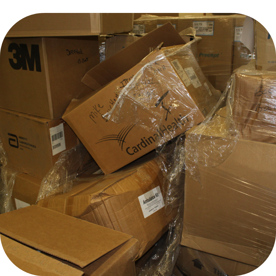 Disorganized boxes of medical supplies in storage