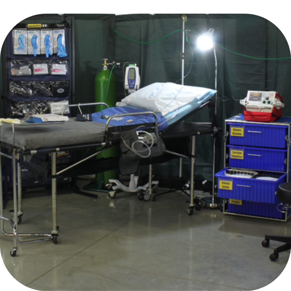 Mobile emergency room set up in a tent at a field operation